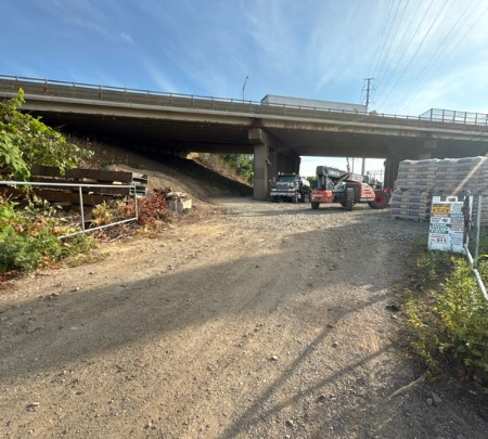 Heavy civil work area beneath a highway bridge
